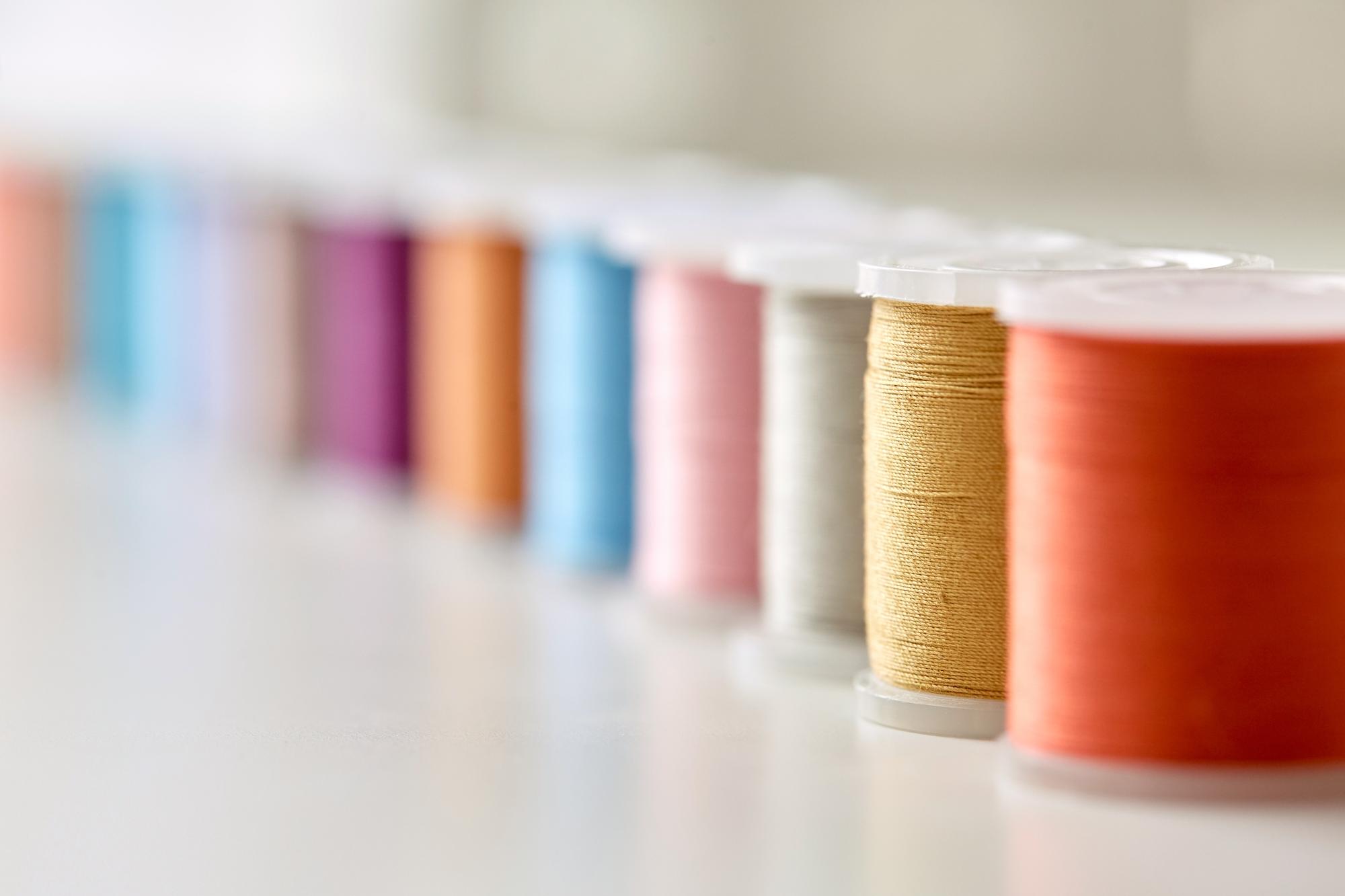selection of thread spools in muted palette